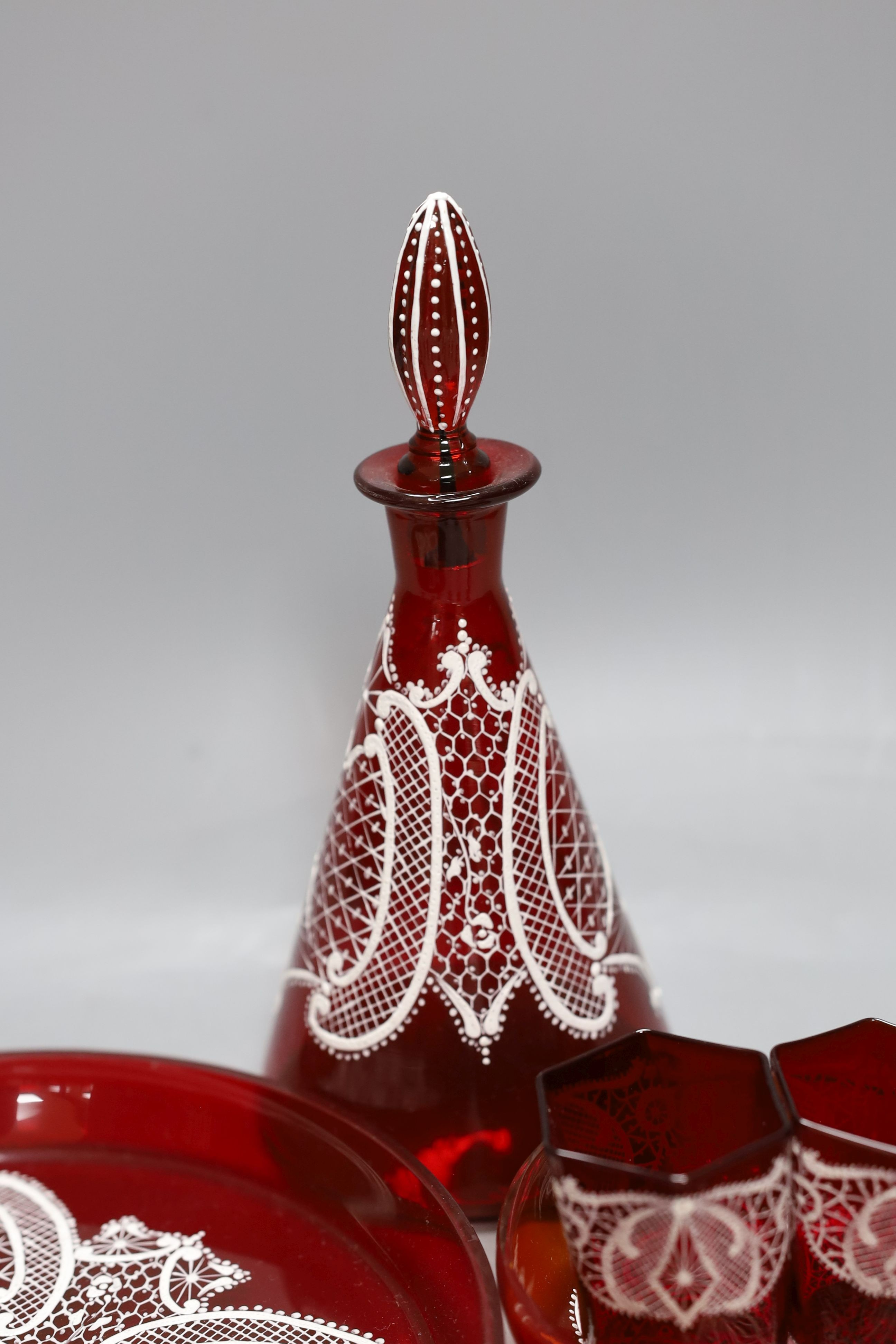 A Venetian red enamelled glass lace-pattern liqueur set